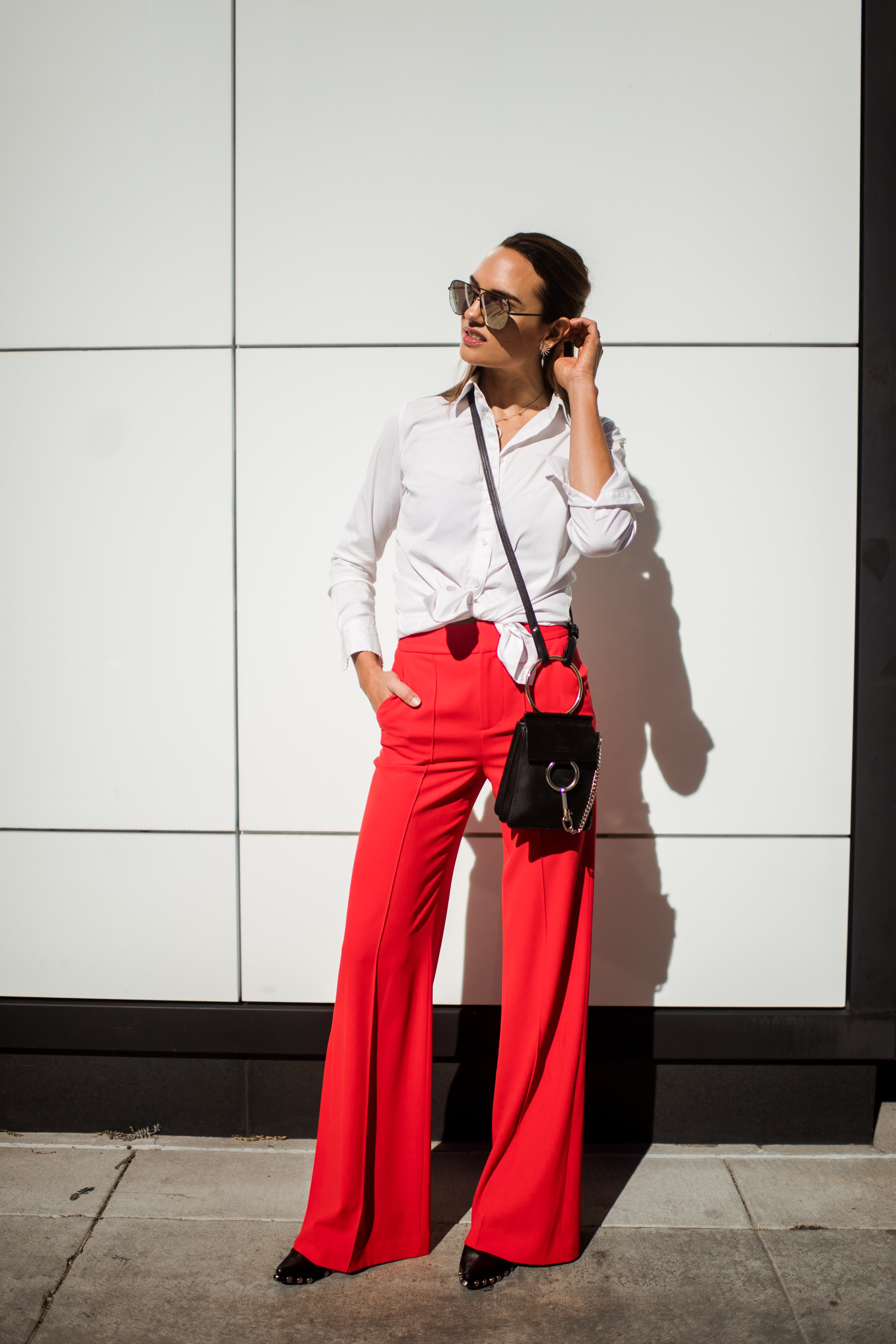 Style an Oversized White Sweater With Bold Red Pants  30 Work Outfits That  Will Get You Through Winter in Style  POPSUGAR Fashion Middle East Photo 24